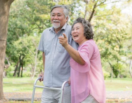 Happy elderly couple with lifestyle after retiree concept. Lovely asian seniors couple walking exercise in the park in the morning.